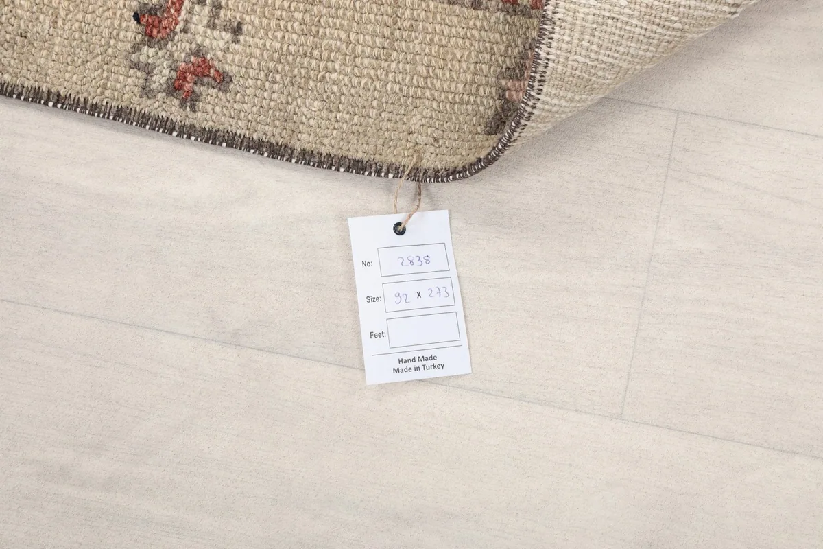 Product tag displaying the rug's dimensions and origin, 'Hand Made in Turkey'