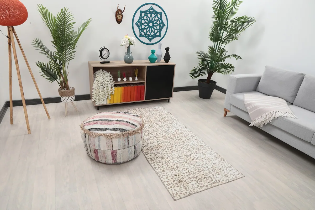 Angle view of the runner in a room setting, showing its placement between furniture.