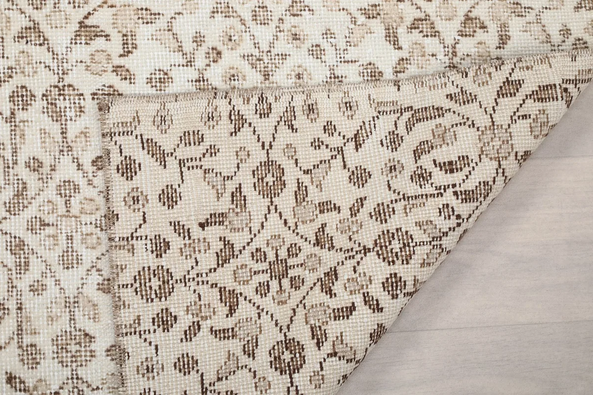 Close-up of the rug's reverse side, showing the knotting and foundation details.