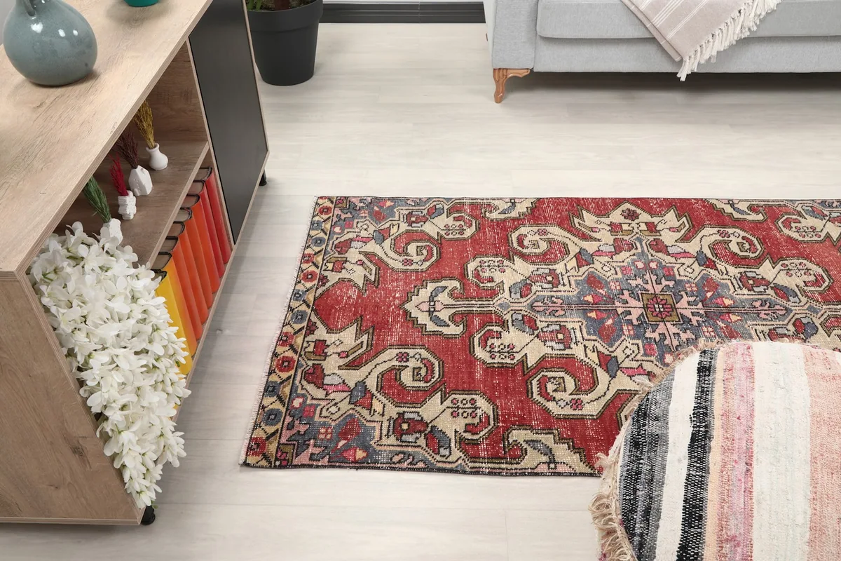 Angled view of the rug in a room, showing its placement relative to furniture and decor.