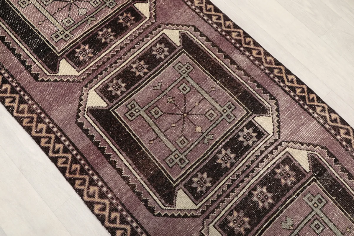 Angled view of the runner's central medallions and connecting patterns