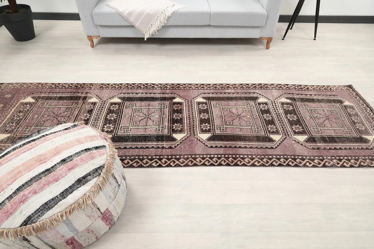Long view of the runner rug stretching across a room from a low angle