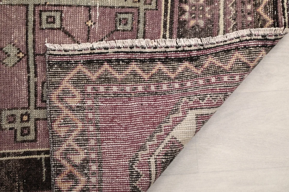 Another folded corner view revealing the rug's construction and fringe detail