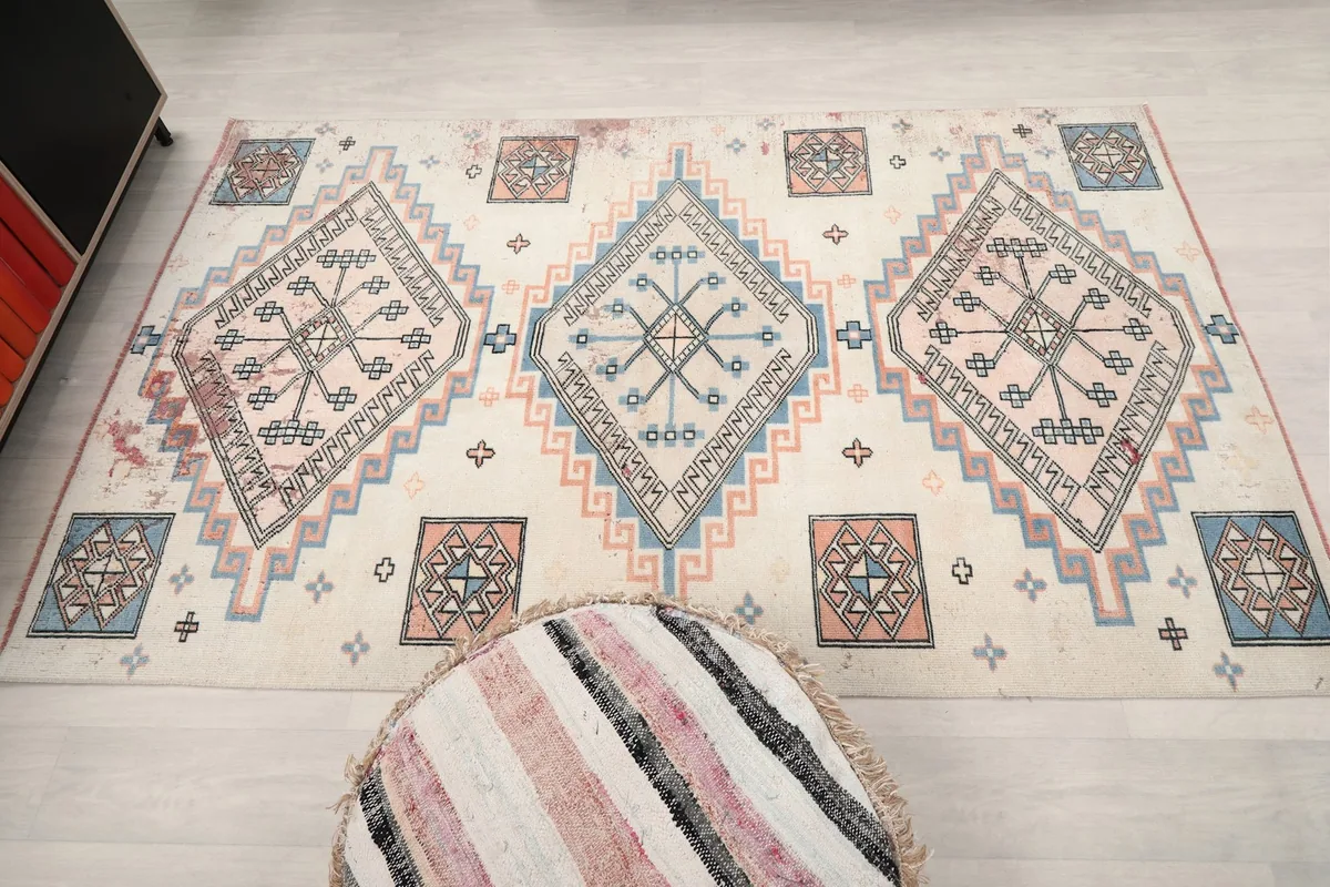 Full room view of the rug from a higher angle, showing its integration into the space.