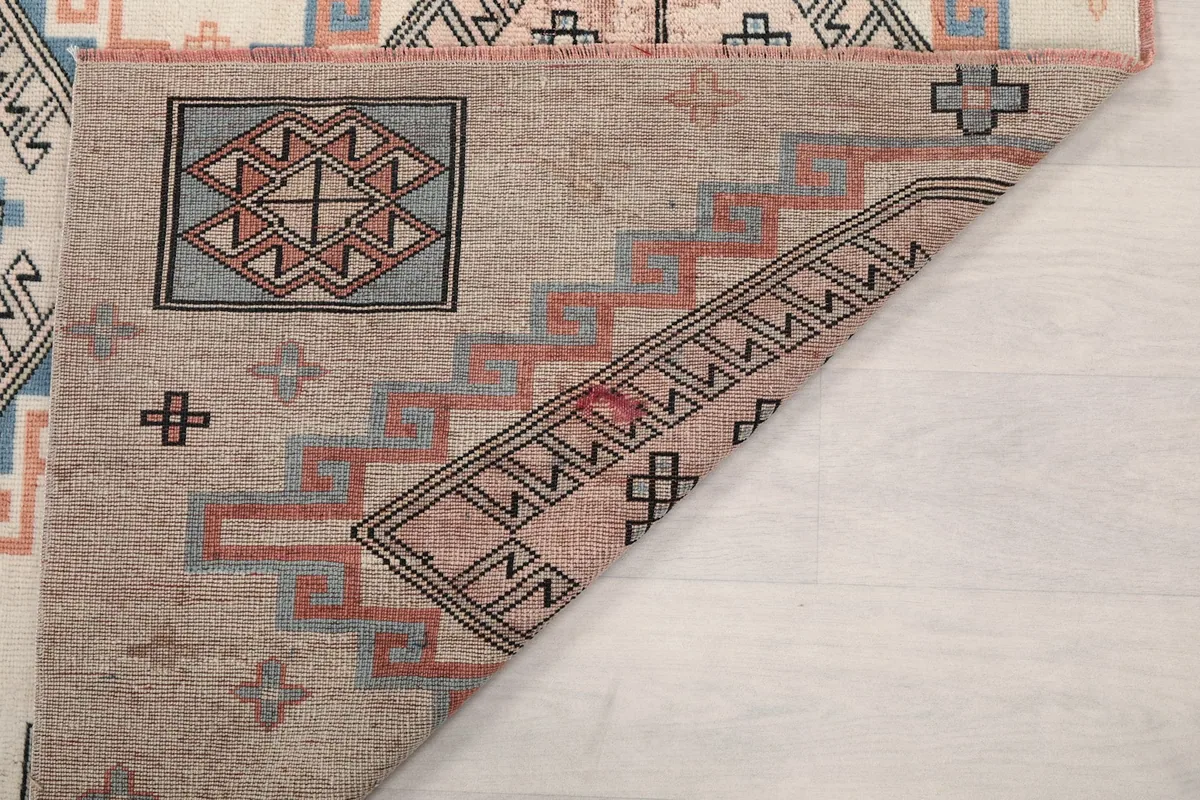 Another view of the rug's reverse, showing the tight hand-knotted construction.