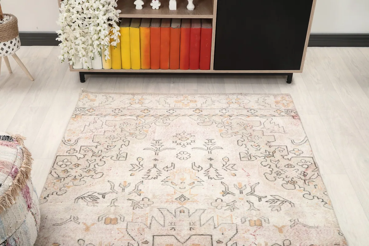 Overhead view showing the rug's placement in the room, highlighting its overall pattern