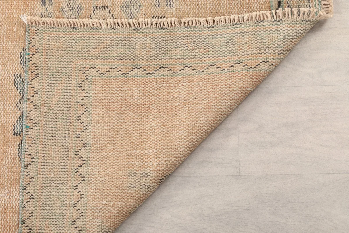 Close-up of the reverse side of the rug, demonstrating the quality of the hand-knotting.