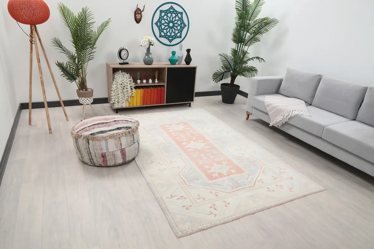 Angle view of the cream and blue geometric rug in a modern living space