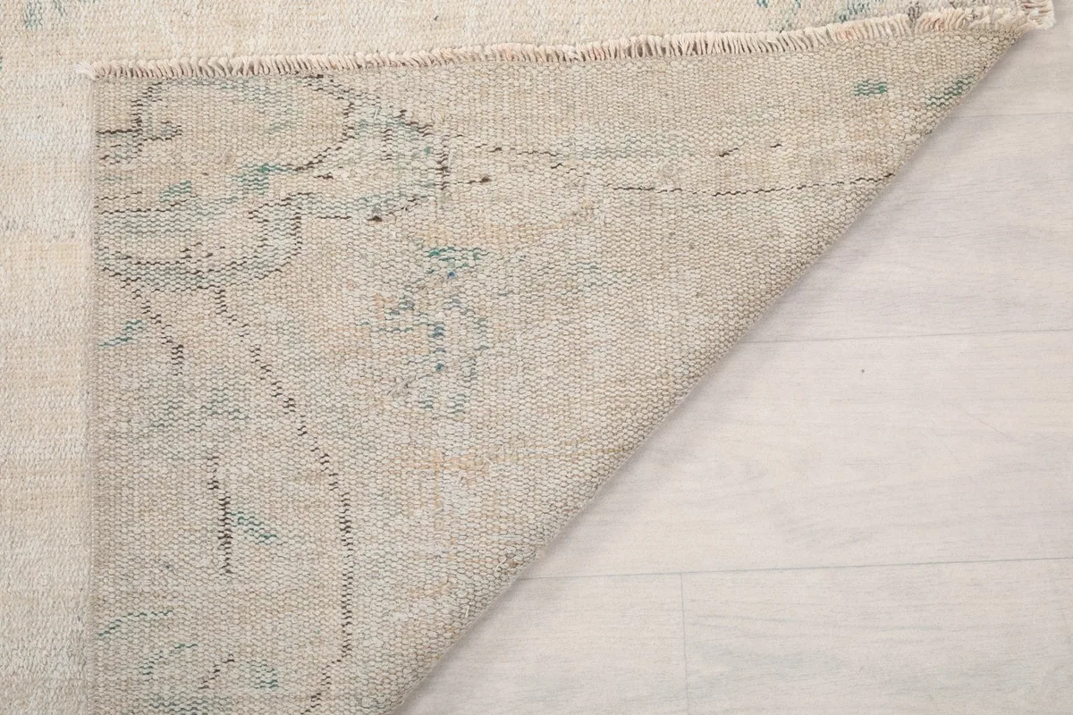 Another view of the rug's back, revealing the tight knotting and foundation structure.