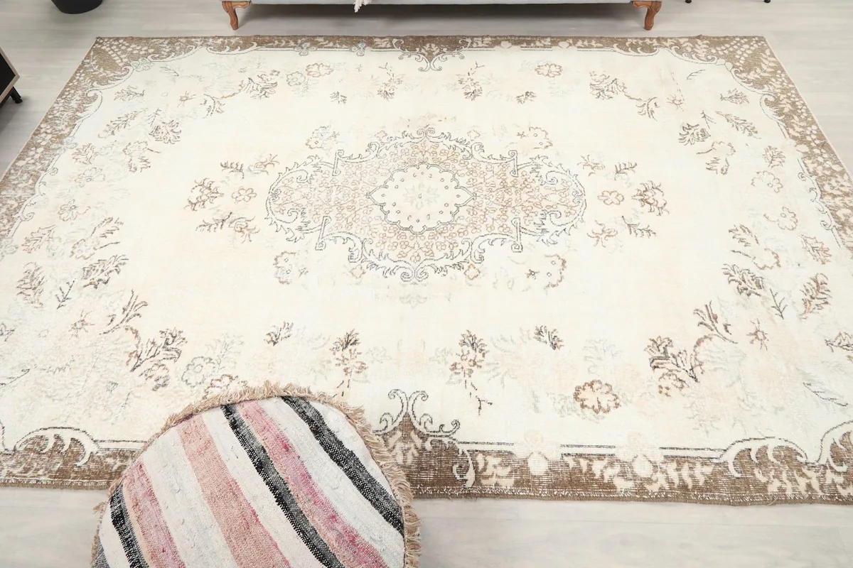 Overhead perspective of the ivory rug, showcasing its complete design and colors