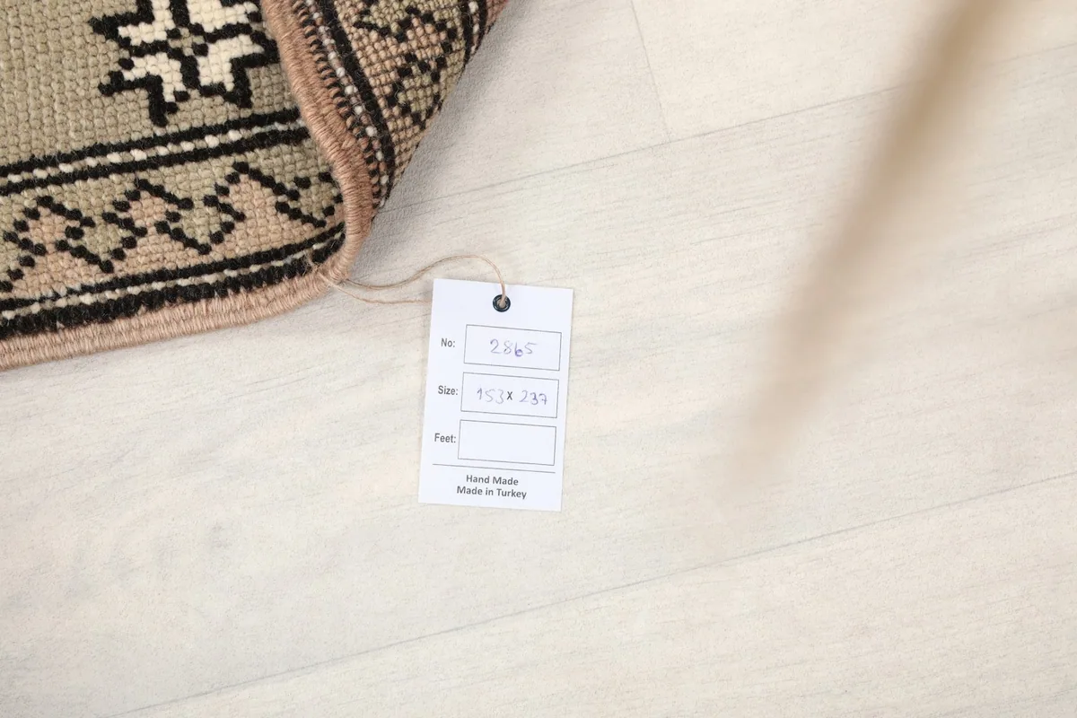 Image showing the product tag with size 5'0" x 7'9" and origin Anatolia, Turkey.