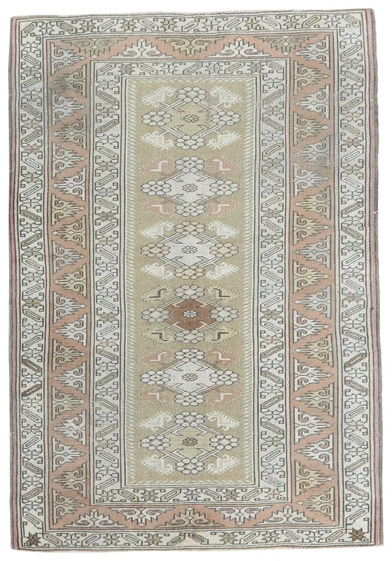 Top view of a beige and rust hand-knotted vintage Anatolian rug with geometric patterns