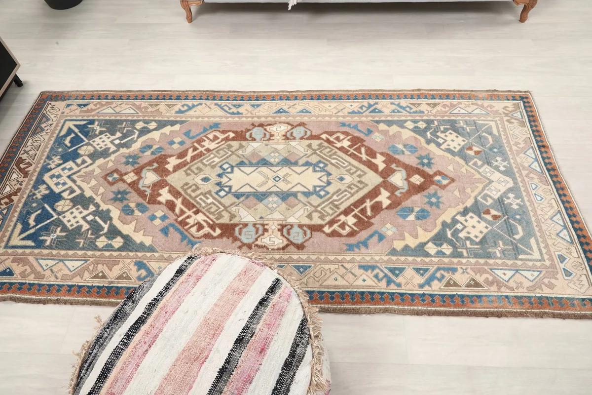 Overhead view of the rug in a room, showcasing its full length and vibrant colors.