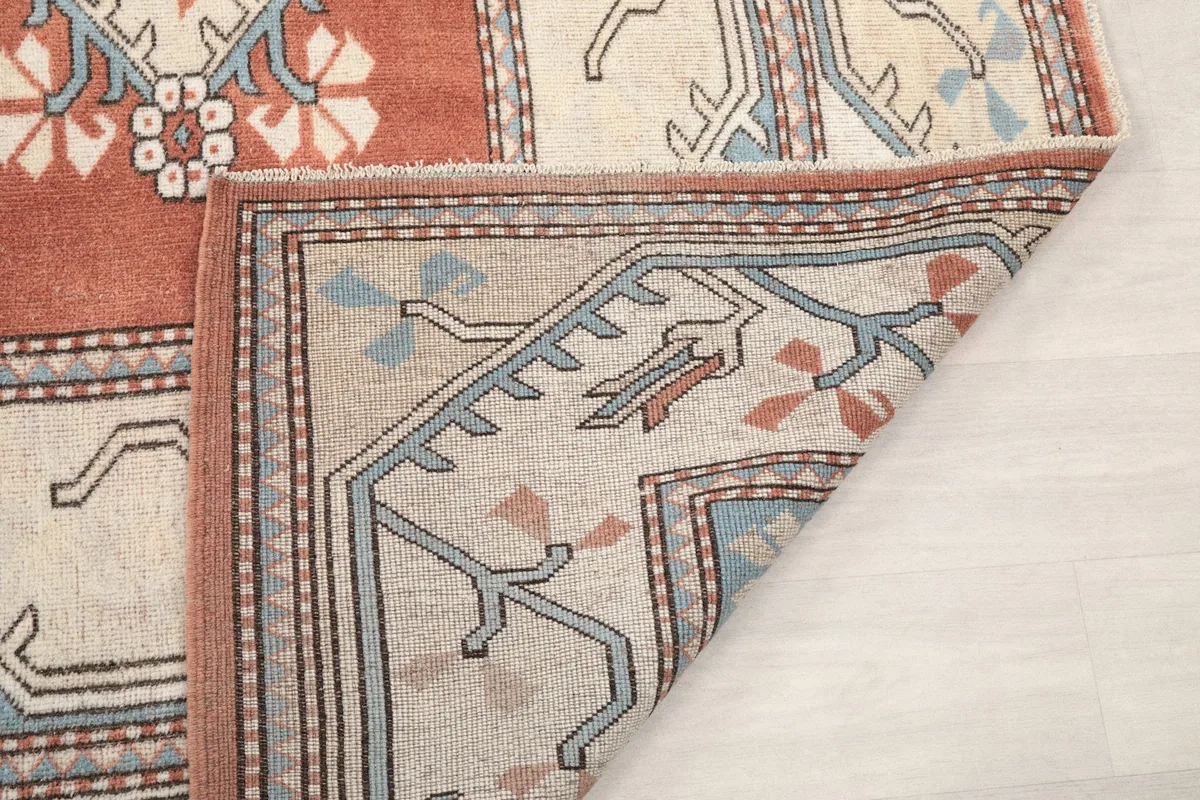 View of the back of the rug, revealing the cotton foundation and hand-knotting
