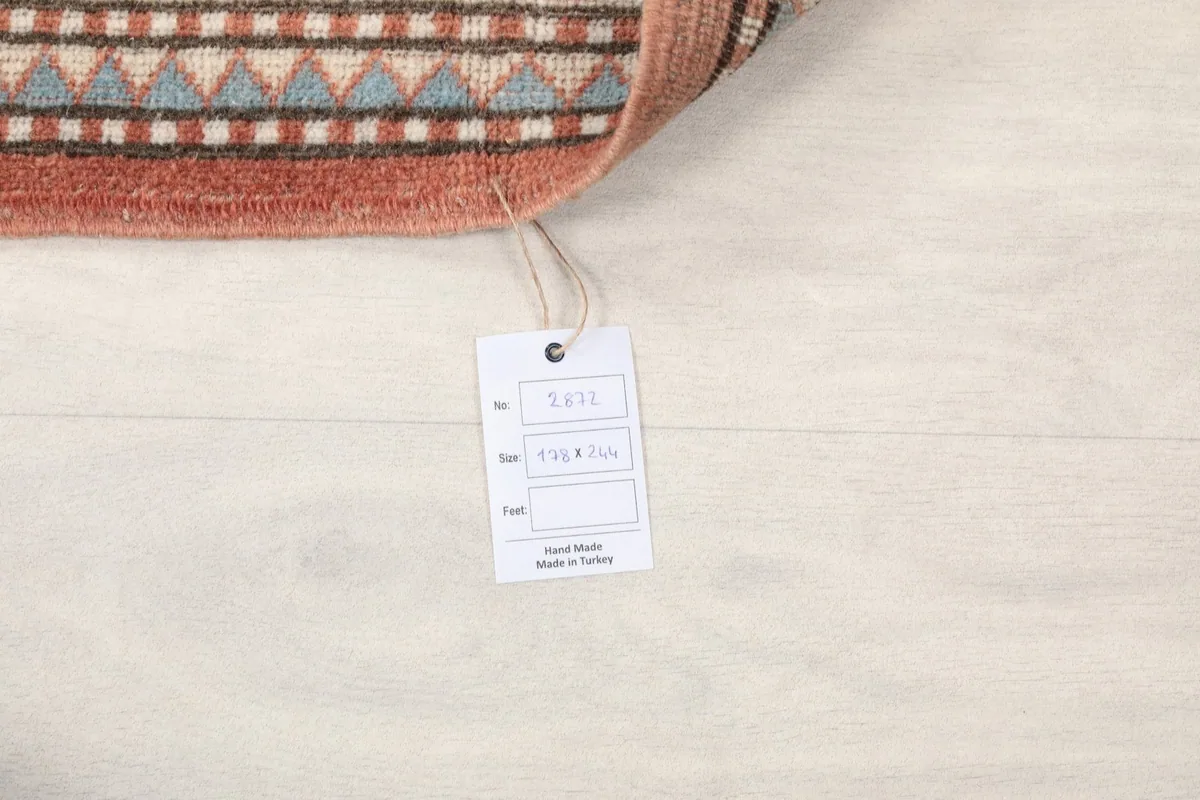 Tag showing the rug's size 5'10" x 8'0" and origin Anatolia, Turkey