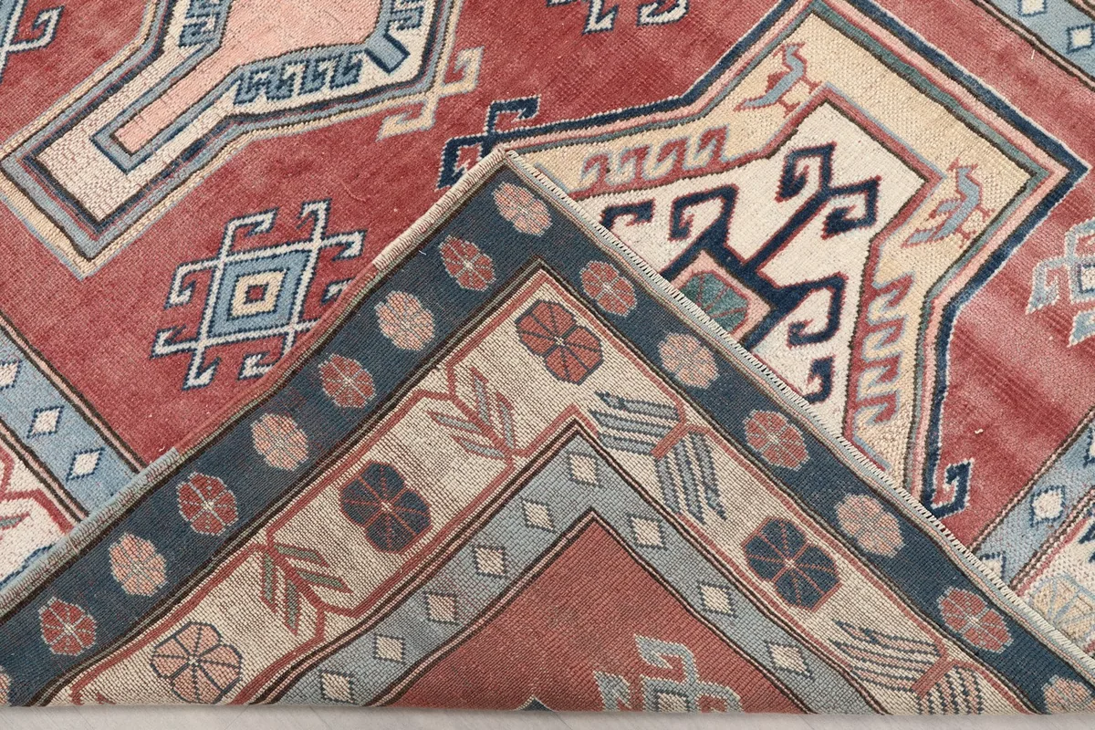 Folded corner of the rug revealing the back of the hand-knotted construction