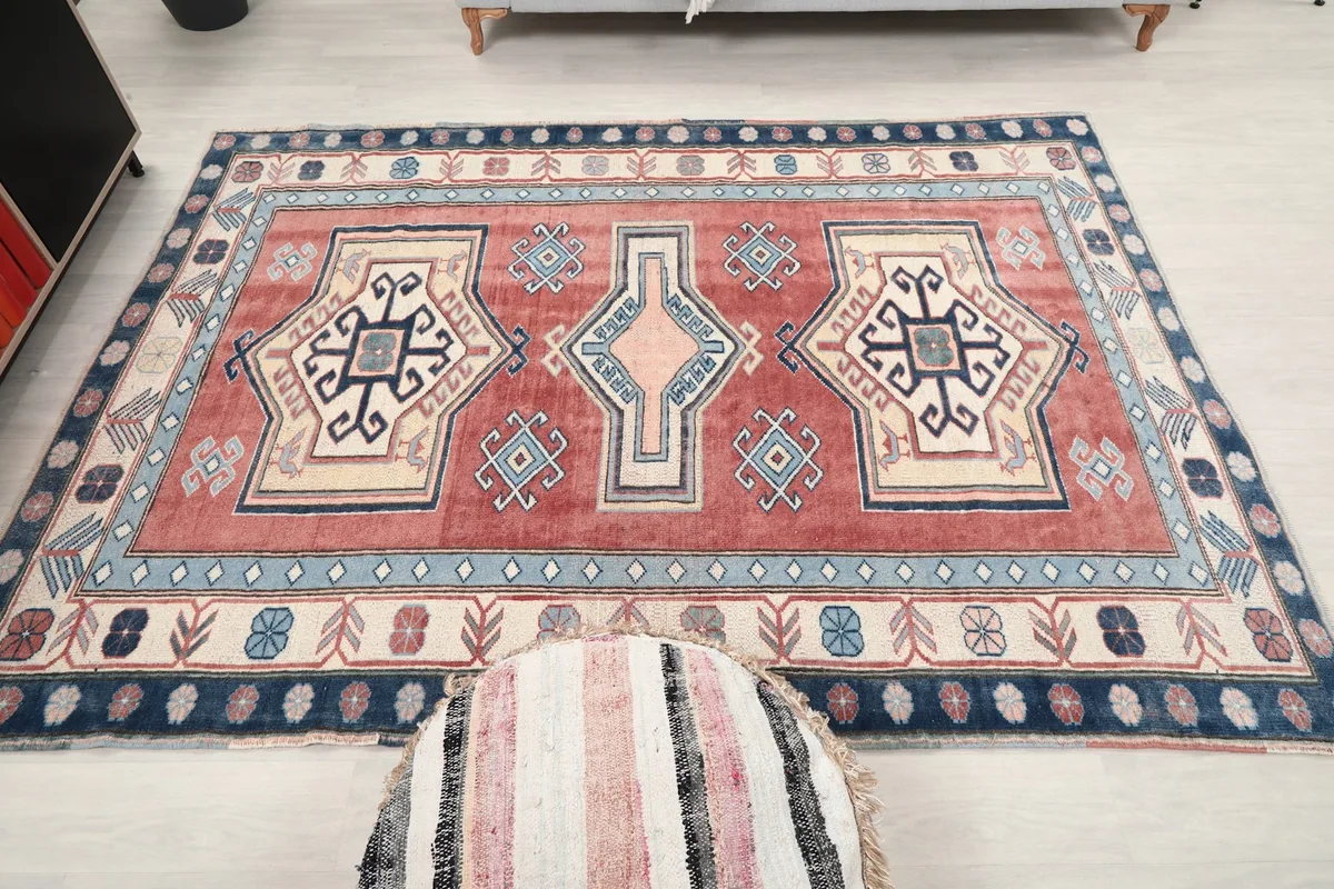 Overhead view of the rug with an ottoman, showing its overall presence