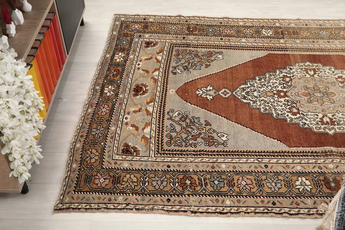 Wide angle view from above, showing the full rug and its colors in a room setting