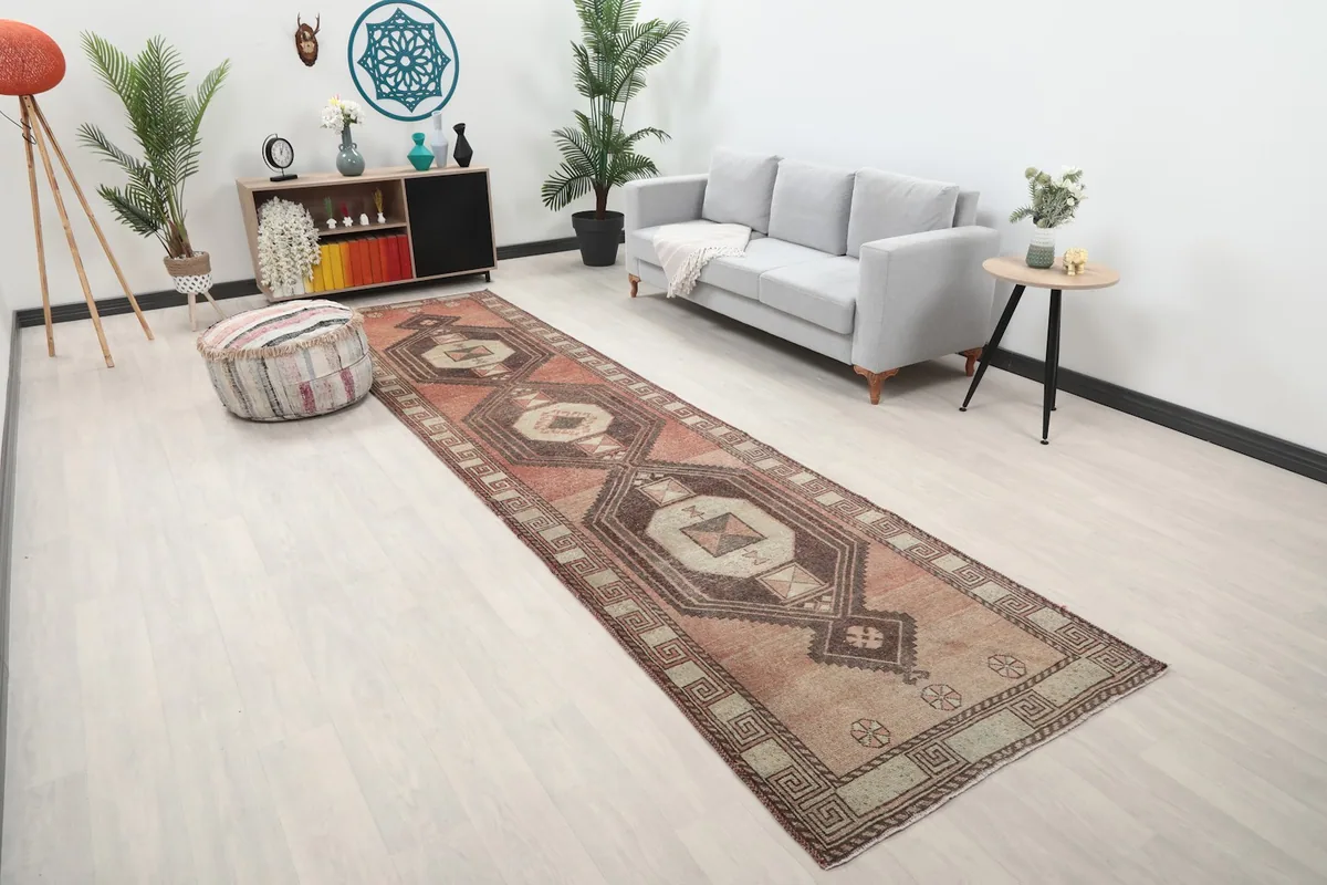 Long runner rug in a modern living space, showing its full length from an angle.