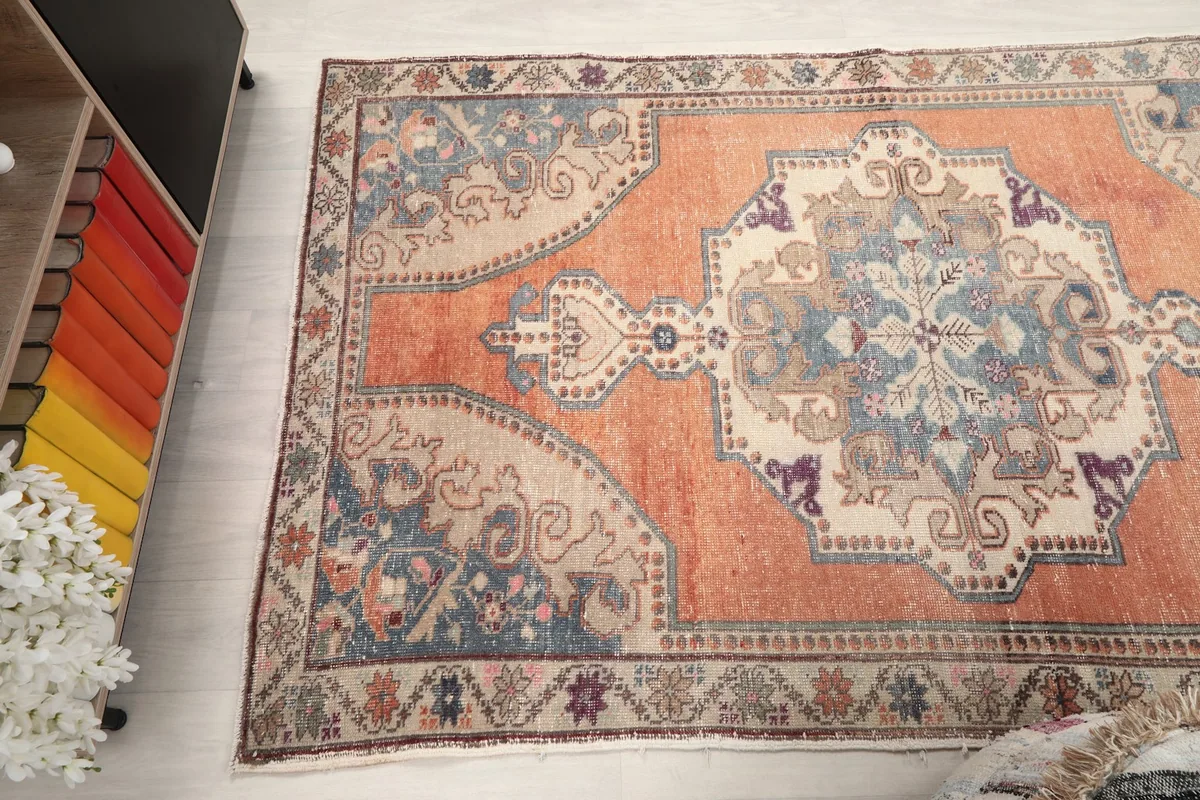 View of the rug from another angle in the room, showing its colors and patterns