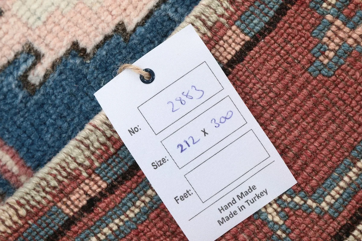 Tag showing the rug's dimensions and hand-made origin from Turkey