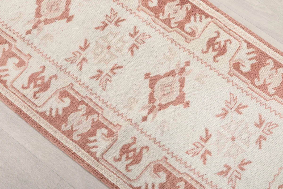 Angled view highlighting the repeating geometric patterns and border design