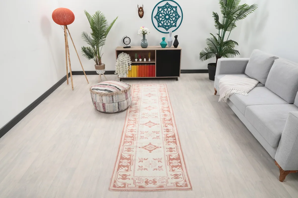Vintage cream and rust runner rug in a modern living room setting