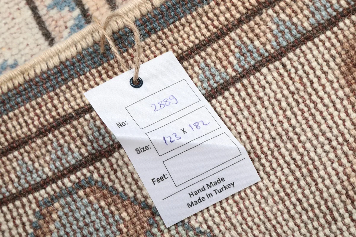 Product tag on the back of the rug with size and origin information