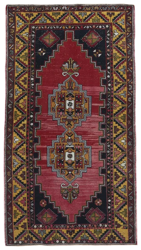 Full overhead view of the vintage red and gold Anatolian rug on a white background.