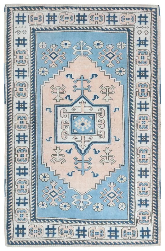 Full overhead view of the 6x9 blue and pink geometric Anatolian rug