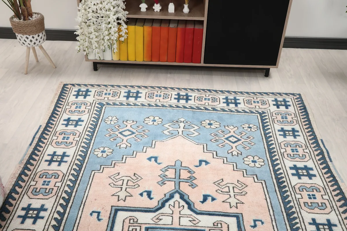 Overhead angle view of the rug's full pattern and color balance in a room