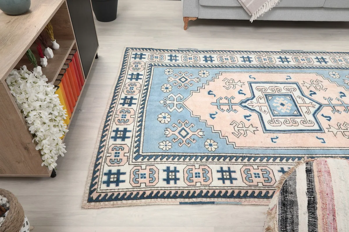 View of the rug in a room, highlighting its placement next to furniture