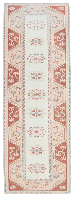Full top view of the 3'1" x 9'4" vintage Anatolian runner rug with ivory field and rust border