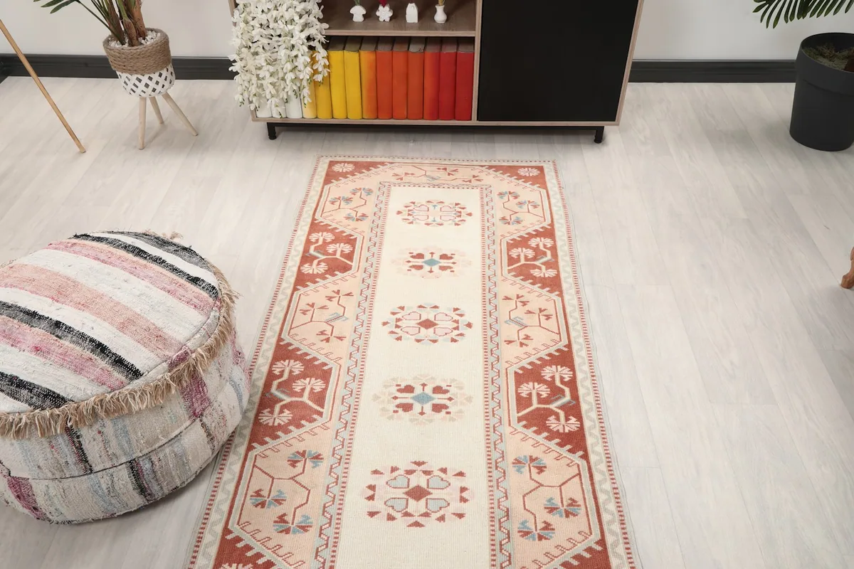 Full view of the vintage runner rug from a higher angle, showcasing its design in a room