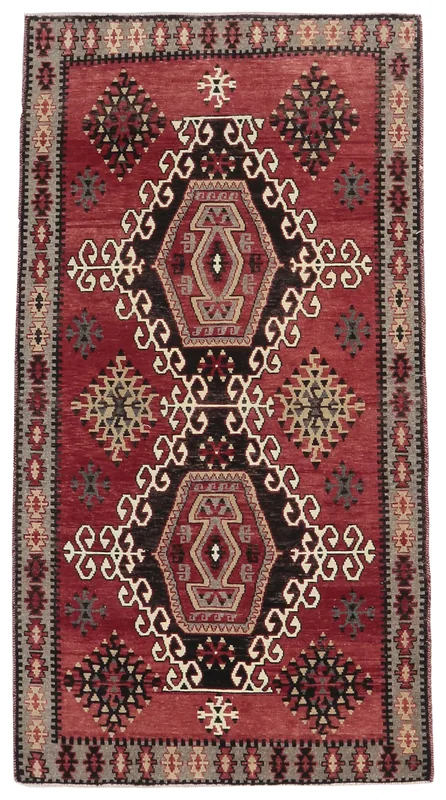 Full overhead view of the Red Tribal Geometric Anatolian Rug on a white background
