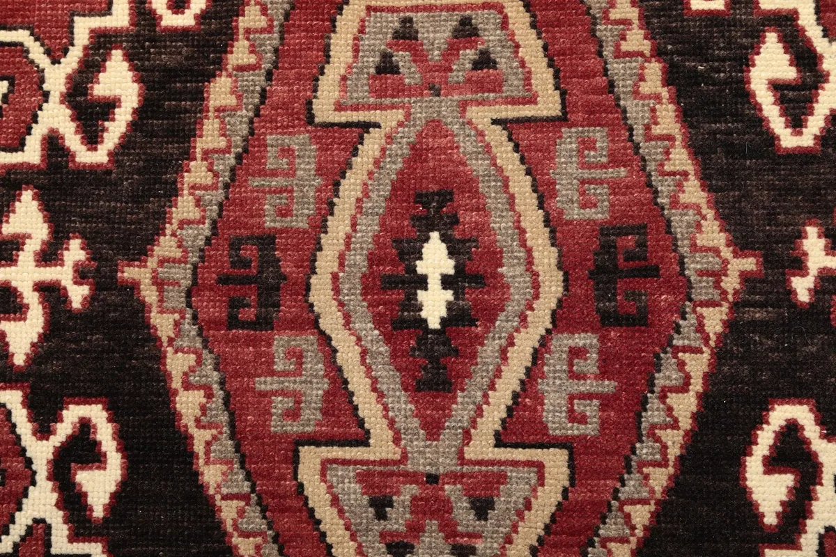 Extreme close-up showing the hand-knotted wool pile texture and knot details