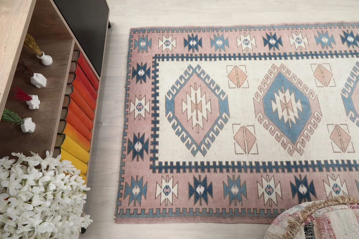 View from an elevated angle showing the rug's patterns and colors in a room