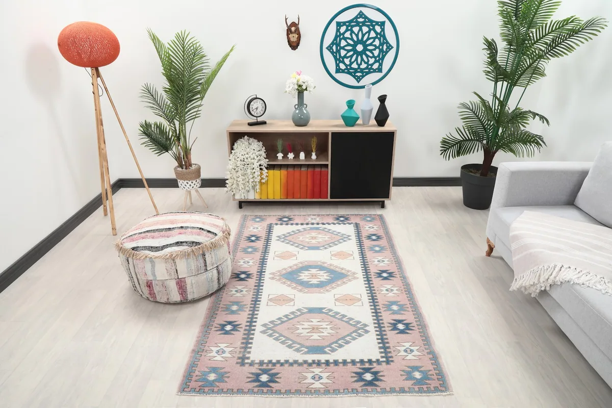 Vintage Anatolian rug in a modern living room setting with light flooring