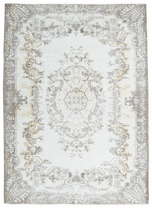 Full top view of an ivory gray floral medallion vintage Anatolian area rug