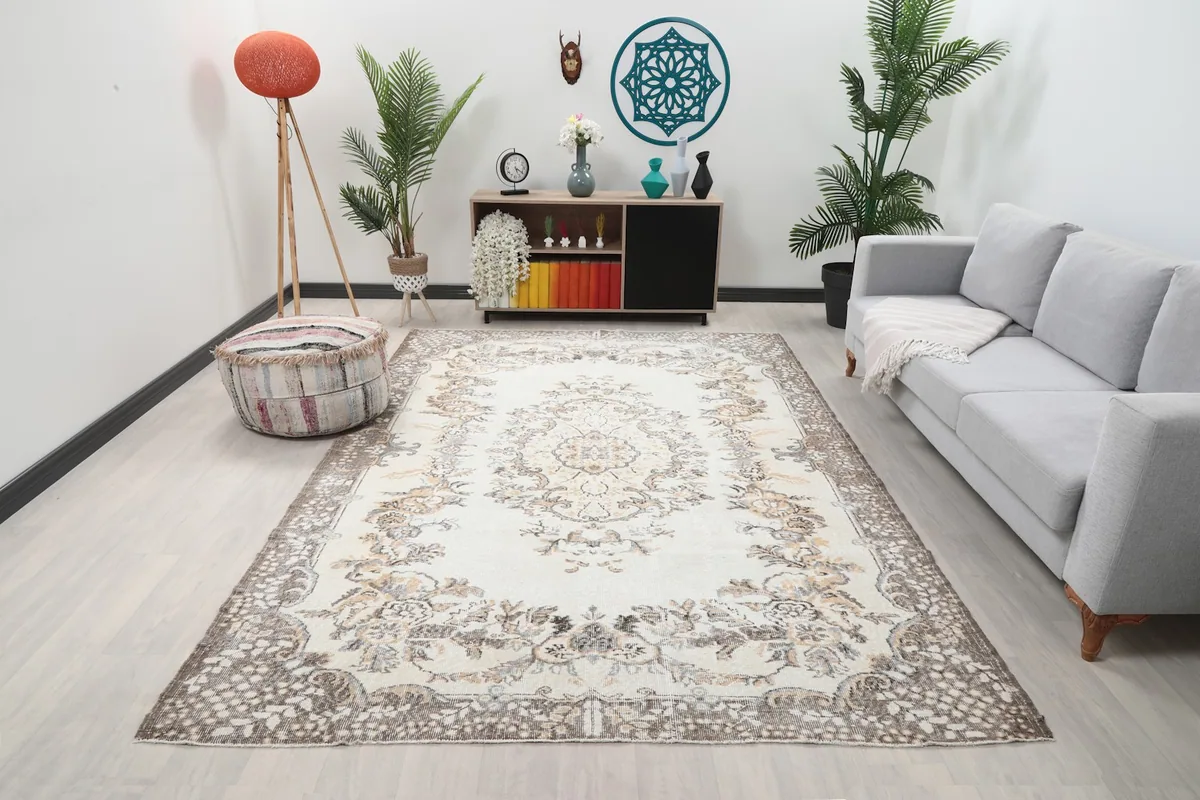 Ivory gray floral medallion vintage rug in a modern living room setting