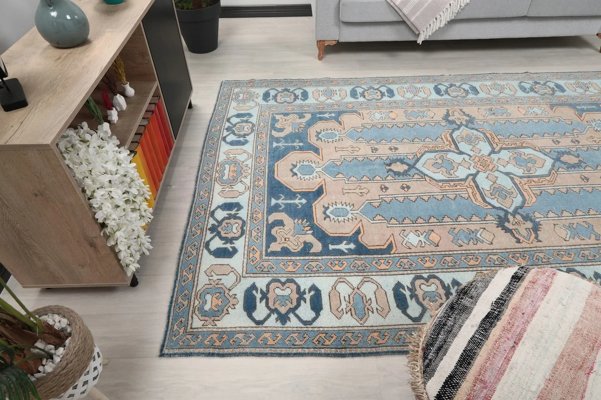 Wide shot of the rug in a room, emphasizing its size and how it complements the space.