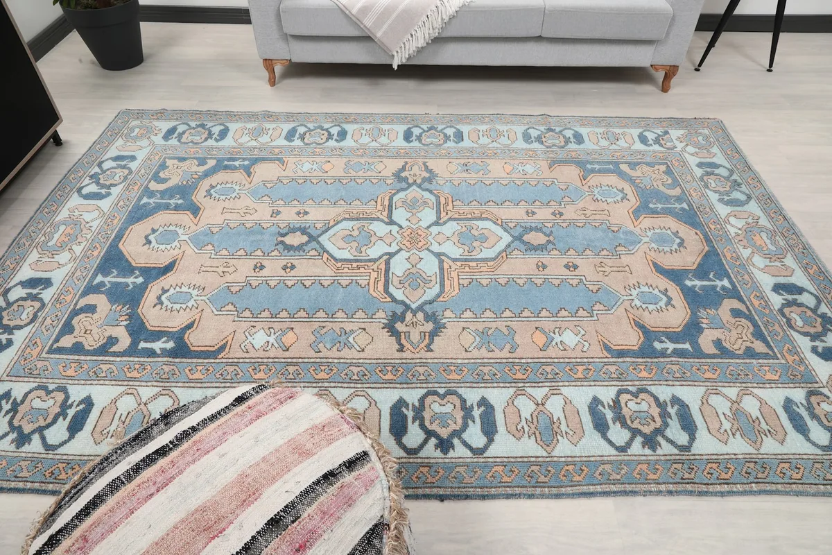 Another wide room shot of the blue and tan rug, showing its full length and width.