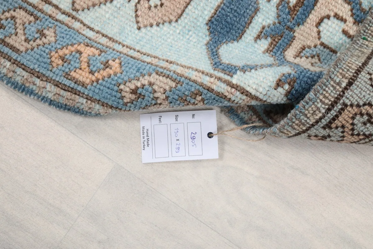 Detail of the rug with its product tag, confirming origin and material.