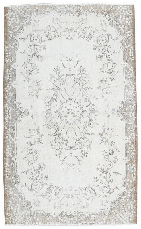 Full top view of the cream and gray floral medallion rug on a white background
