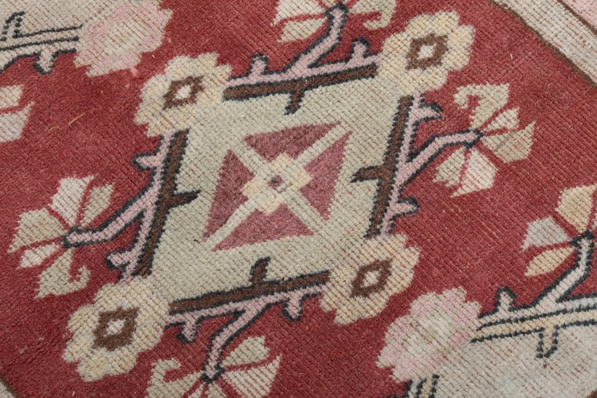 Macro view of the hand-knotted wool pile showing texture and color variations