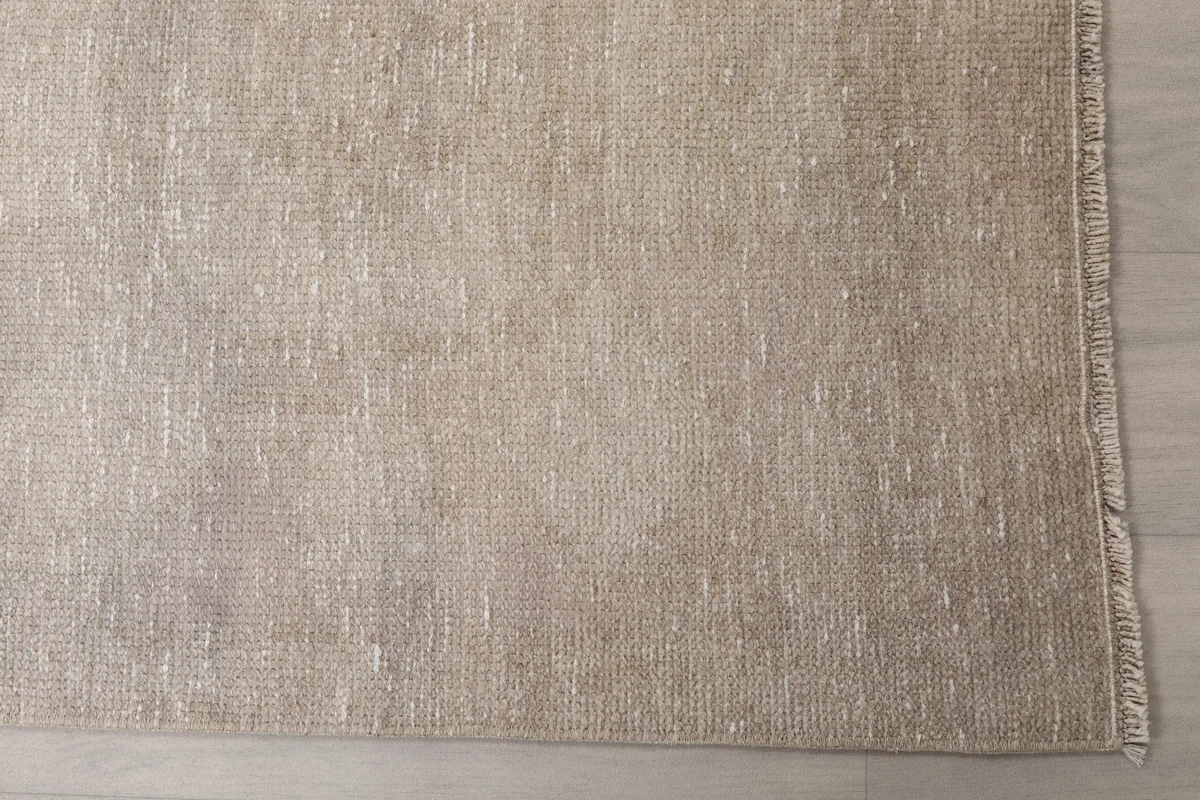 Close-up detail of the Beige Distressed Anatolian Runner's low pile and weave structure.