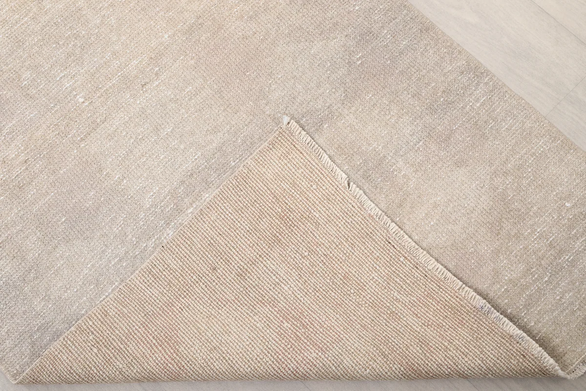 View of the back of the Beige Distressed Anatolian Runner, showing the cotton foundation and hand-knotted construction.