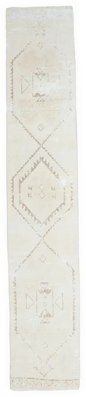 Full overhead view of the 2'9" x 13'1" ivory geometric vintage Anatolian runner rug