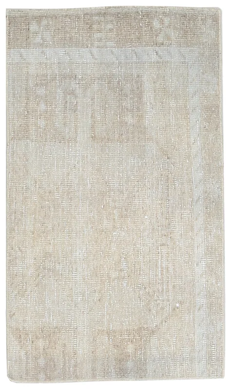 Full overhead view of the beige vintage Anatolian rug on a white background