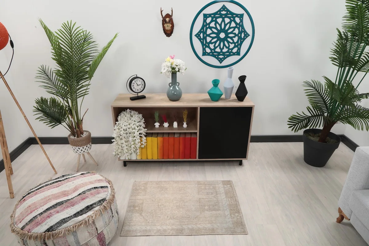 Beige rug in a modern living space with light-colored flooring and furniture